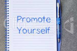 Promote yourself write on notebook