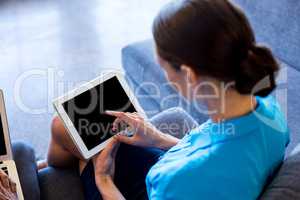 Woman using digital tablet