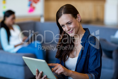 Young woman using digital tablet