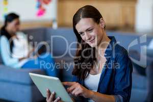 Young woman using digital tablet