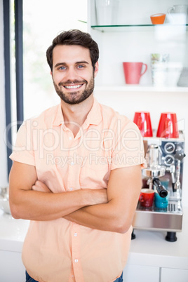 Man with arms crossed smiling at camera Man with arms crossed smiling at camera