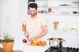Man chopping vegetables