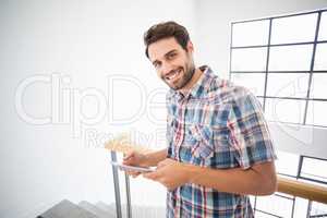 Man holding digital tablet at home