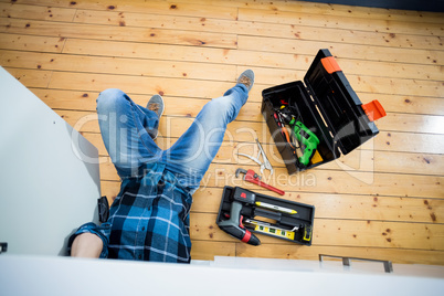 Man fixing kitchen sink