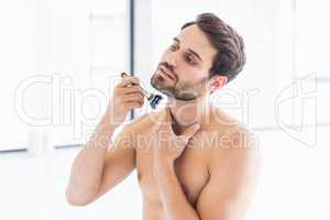 Man shaving in the bathroom