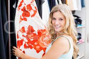 Young woman selecting clothes