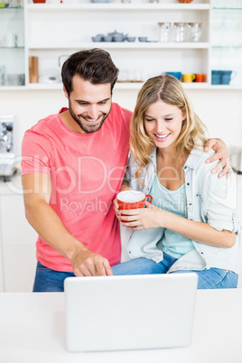 Young couple using laptop