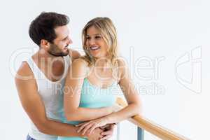 Young couple standing near the railing