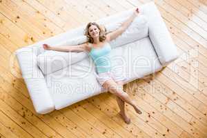 Young woman relaxing on sofa