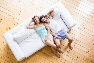 Young couple relaxing on sofa