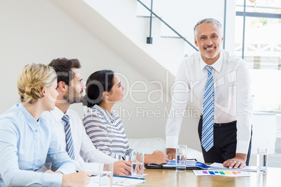 Business colleagues sitting together in meeting