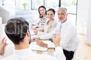 A businessman is talking to his colleagues