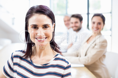 A businesswoman is smiling and posing