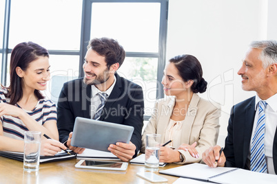 Workers are smiling and looking each other