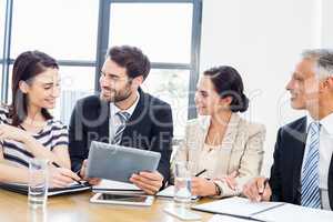 Workers are smiling and looking each other