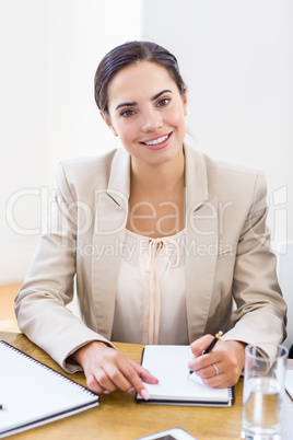 A businesswoman are posing and smiling