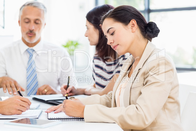 A businesswoman is taking some notes