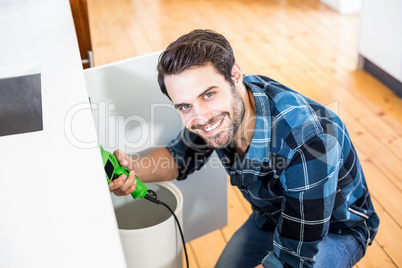 Man fixing kitchen sink