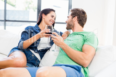 A couple having a drink and looking each other