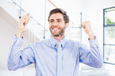 Excited businessman in office