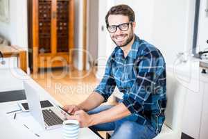 Man sitting on chair and using mobile phone