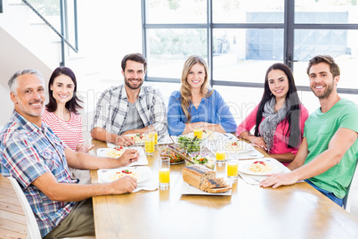 Family having a lunch and smiling