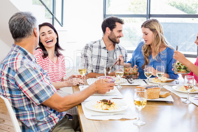 Friends interacting while having a meal