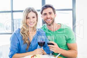 Young couple holding a wine glass