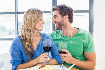 Young couple holding a wine glass