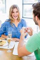 Man gifting finger ring to his woman