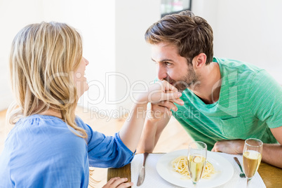 Man kissing a womans hand