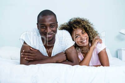 Portrait of young couple in the bedroom