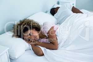 Young couple sleeping back to back and ignoring each other
