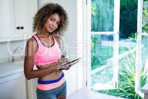 Young woman using digital tablet