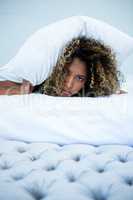 Young woman relaxing on bed