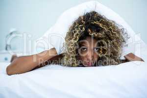 Young woman relaxing on bed