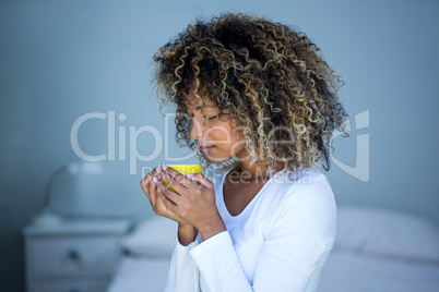 Young woman having a cup of coffee