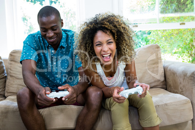 Young couple playing video game