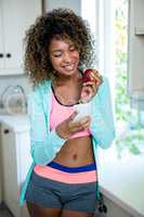 Young woman text messaging on phone