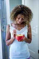 Young woman having breakfast