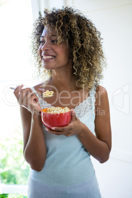 Thoughtful woman having breakfast in the morning
