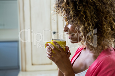 Young woman drinking a coffee on bed Young woman drinking a coffee on bed