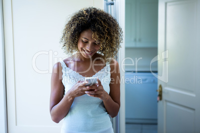 Young woman text messaging on phone