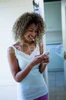 Young woman text messaging on phone