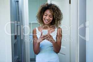 Young woman text messaging on phone