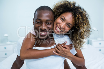 Young couple embracing each other on bed Young couple embracing each other on bed