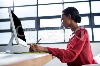 Woman working on her graphics tablet