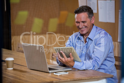 Man using digital tablet in office