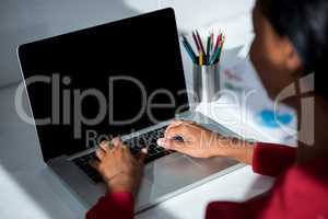 Woman using laptop in office