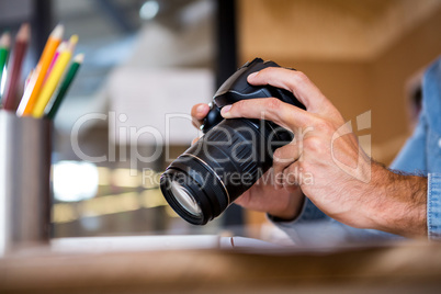 Man checking photos in camera
